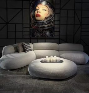 The light shines on the table in front of the sofa